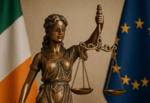 Bereaved Partner's Pension Statue of Lady Justice with Irish flag, symbolising new legislation for the Bereaved Partner’s Pension.