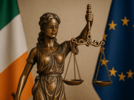 Bereaved Partner's Pension Statue of Lady Justice with Irish flag, symbolising new legislation for the Bereaved Partner’s Pension.