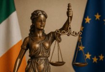 Bereaved Partner's Pension Statue of Lady Justice with Irish flag, symbolising new legislation for the Bereaved Partner’s Pension.
