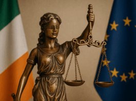 Bereaved Partner's Pension Statue of Lady Justice with Irish flag, symbolising new legislation for the Bereaved Partner’s Pension.
