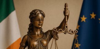 Bereaved Partner's Pension Statue of Lady Justice with Irish flag, symbolising new legislation for the Bereaved Partner’s Pension.